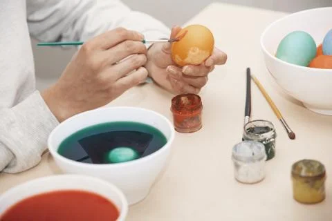 Woman preparing Easter eggs Stock Photos