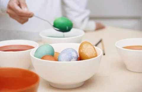Woman preparing Easter eggs Stock Photos