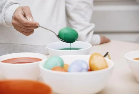 Woman preparing Easter eggs Stock Photos