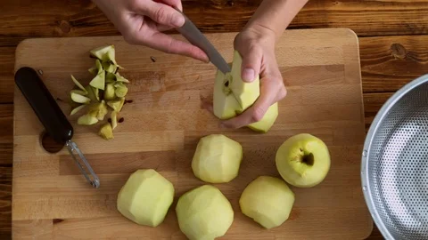 Woman preparing green apples for jam or pie, top view video Stock Footage 97137553
