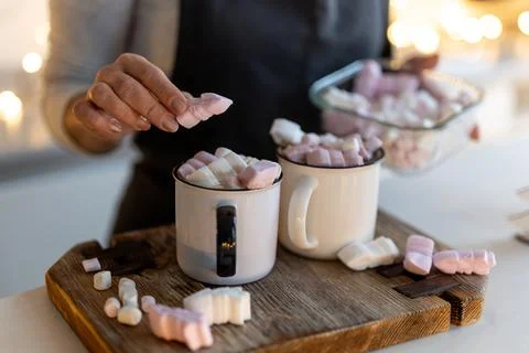 Woman Preparing Hot Cocoa Drink In Christmas Decorated Kitchen Stock Photos