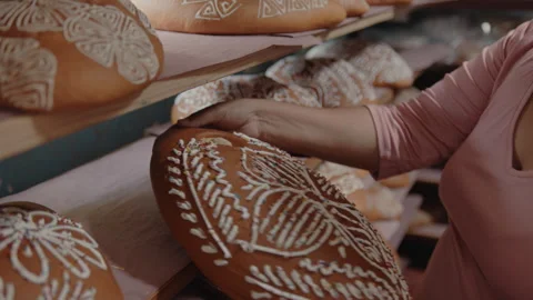 Woman preparing Mexican Bread being decorated for the festival Stock Footage 270100456