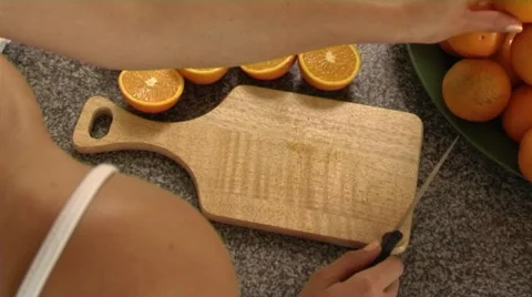 Woman preparing oranges in kitchen Stock Footage 43682306