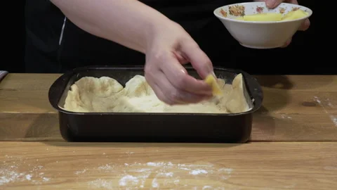 Woman is preparing a pie with fish Stock Footage 133188156