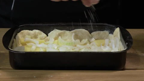 Woman is preparing a pie with fish Stockbeeldmateriaal 133188569