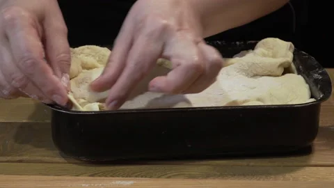 Woman is preparing a pie with fish 動画素材 133190875