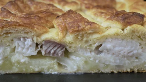 Woman is preparing a pie with fish Stock Footage 133192342
