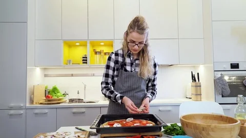 Woman preparing pizza Stock Footage