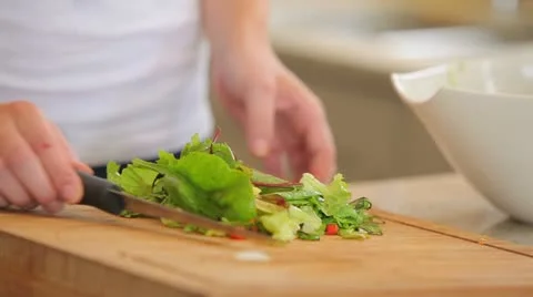 Woman preparing salad Stock Footage