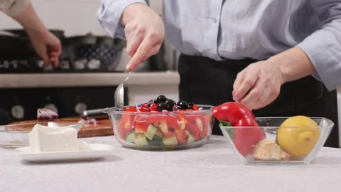A woman is preparing a salad. Stock Footage 306309564