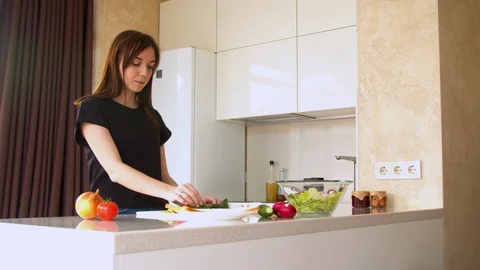 Woman preparing sandwich in kitchen Stock Footage 130066089