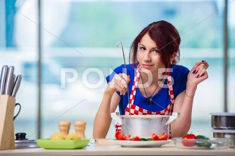 Woman Preparing Soup In The Kitchen