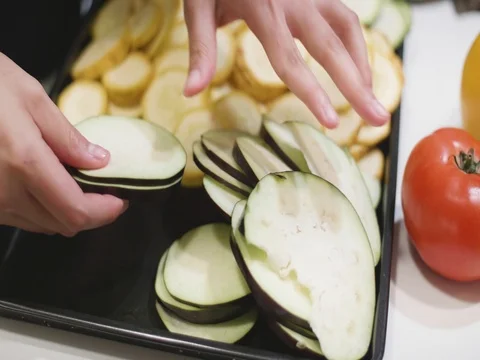 Woman preparing vegetables for dinner Stock Footage 80543511