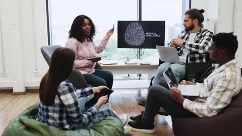 Woman presenting artificial intelligence concept to team in meeting Stock Footage 318207064