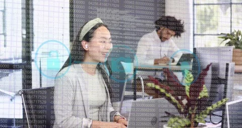 Woman presenting security data to camera in office, typing and initiating Stock Footage 321763673