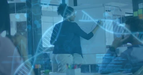Woman presenting tech project on flipchart in office, highlighting code overlay Stock Footage 307435105