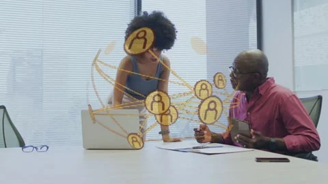 Woman presenting while man with tablet following gold network appearing above Stockbeeldmateriaal 333132213