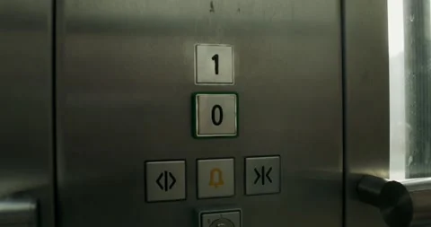 A woman presses a button in the elevator Stock Footage 269027686