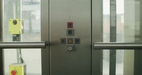 A woman presses a button in the elevator Stock Footage 269028650
