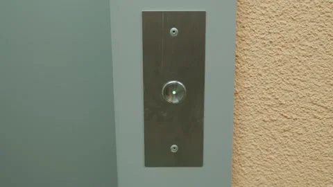 Woman presses the elevator button. the finger presses the elevator button. The Stock Footage 250967635