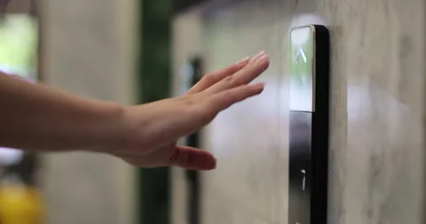 Woman presses the elevator button in office center or hotel. Elevator door Stock Footage 314496580