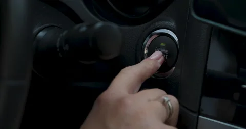 Woman Presses Engine Start Button to Start or Stop Motor of the Modern Car Stock Footage 195220690