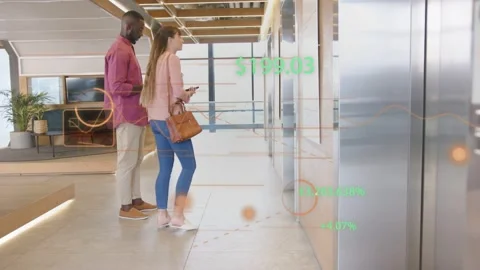 Woman pressing elevator panel, man using tablet, office AR showing numbers and 库存影片 333477568
