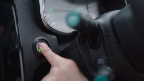 Woman pressing an engine start button. Stock Footage 181999096
