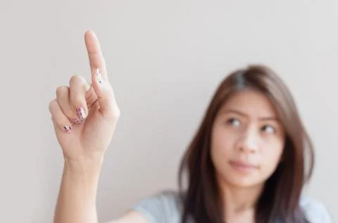 Woman pressing an imaginary button empty space Foto stock