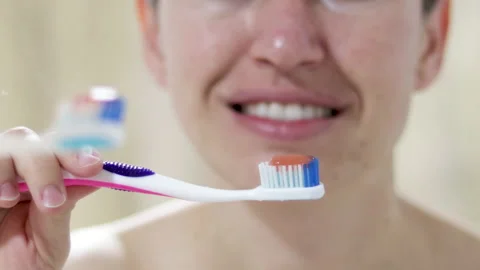 Woman with problematic skin is brushing her teeth Vídeo Stock 189930927