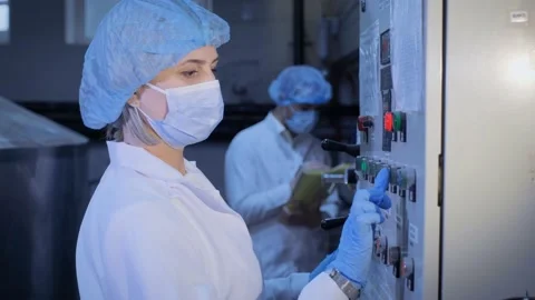 A woman in production controls the process Video stock 149740327