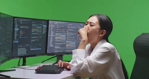 Woman programer on green screen (126)Side View Of Tired Asian Woman Developer Stock Footage 231171716