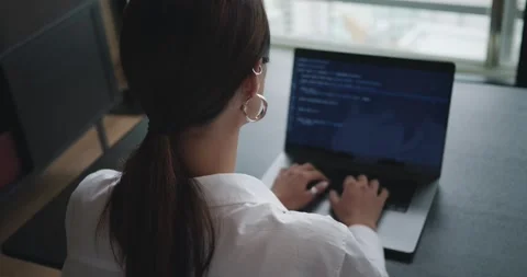 Woman programer typing code on computer keyboard to develop new app server Stock Footage 254342554