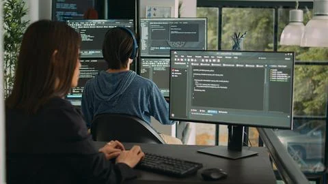Woman programer typing source code on computer keyboard 스톡 사진