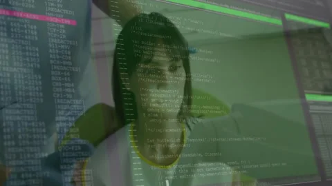 Woman programmer coding at desk in tech lab with animated code overlay filling Stock Footage 307466313