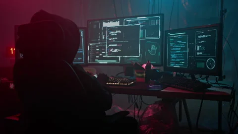 Woman programmer types on back-lit keyboard coding program Stock Footage 257813177