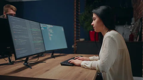 Woman programmer writing code on computer, middle data analyst working in office Stock Footage 233740187