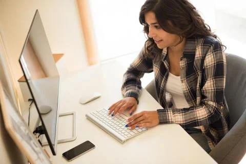 Woman programming computer Stock Photos