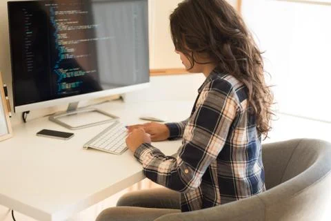 Woman programming computer Stock Photos