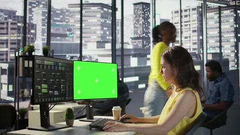 Woman programming using chroma key computer Stock Footage 318161254