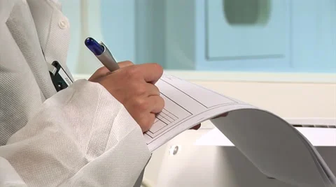 Woman in protective suit taking notes Vidéo 68018087