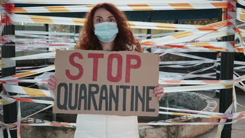 Woman protest Stop quarantine cardboard stands of closed shops in lockdown Stock Footage 144122853