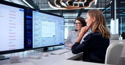 Woman Provides IT Support Solving Customer Issue On Helpdesk Software. Stock Photos