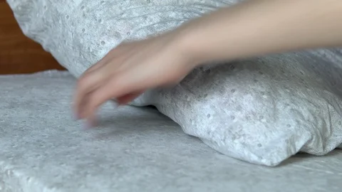 A woman pulled a smartphone out from under the pillow closeup. 스톡 동영상 128016016