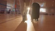 Woman Pulling A Carry On Suitcase Stock Footage