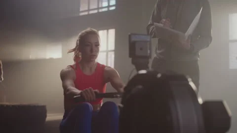 Woman pulling rowing machine Stock-Footage 236182414