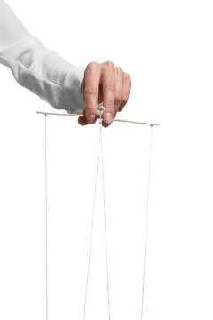Woman pulling strings of puppet on white background, closeup Stock Photos