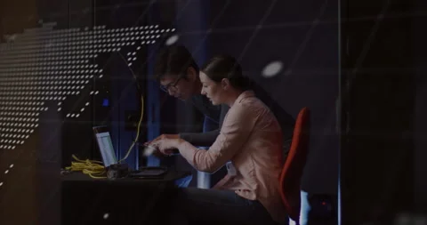 Woman pulling tablet after scrolling laptop and colleague pointing at tech code Stock Footage 312348801