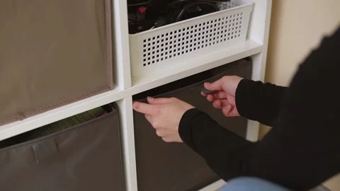 Woman pulls out a box with a cat inside. Stock Footage 143472539
