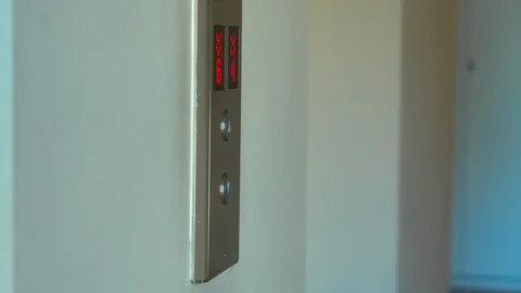 Woman push the button to call an elevator Stock Footage 88273766